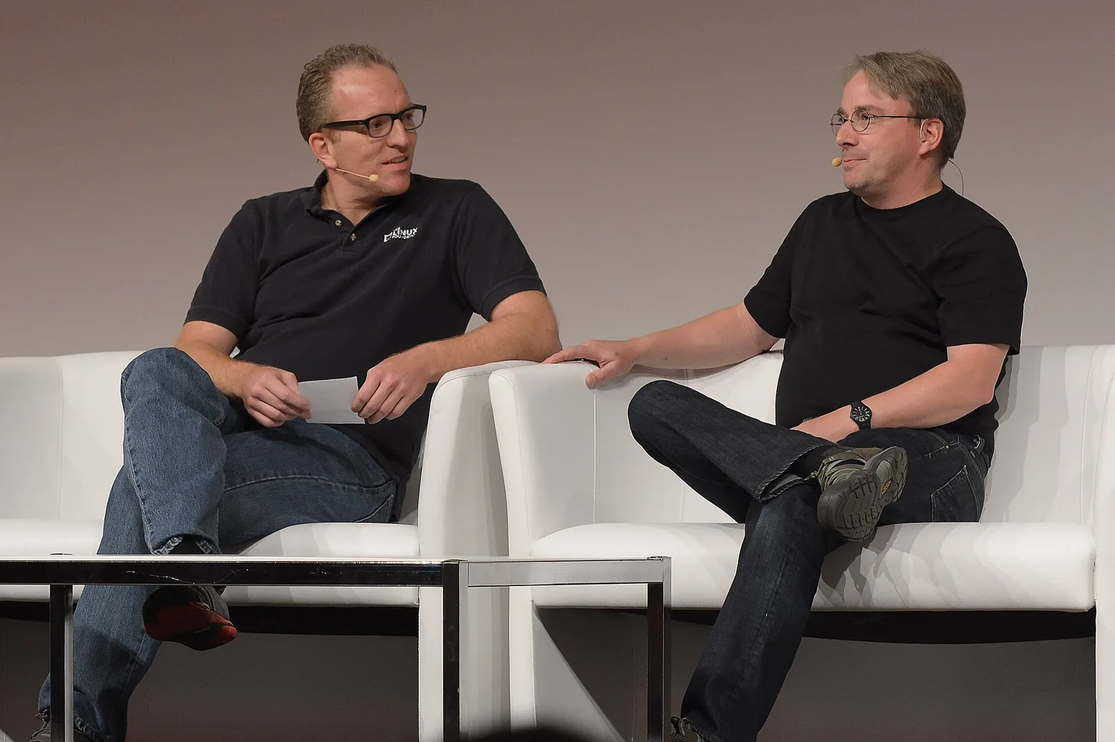 Linus Torvalds seated on stage during an interview.